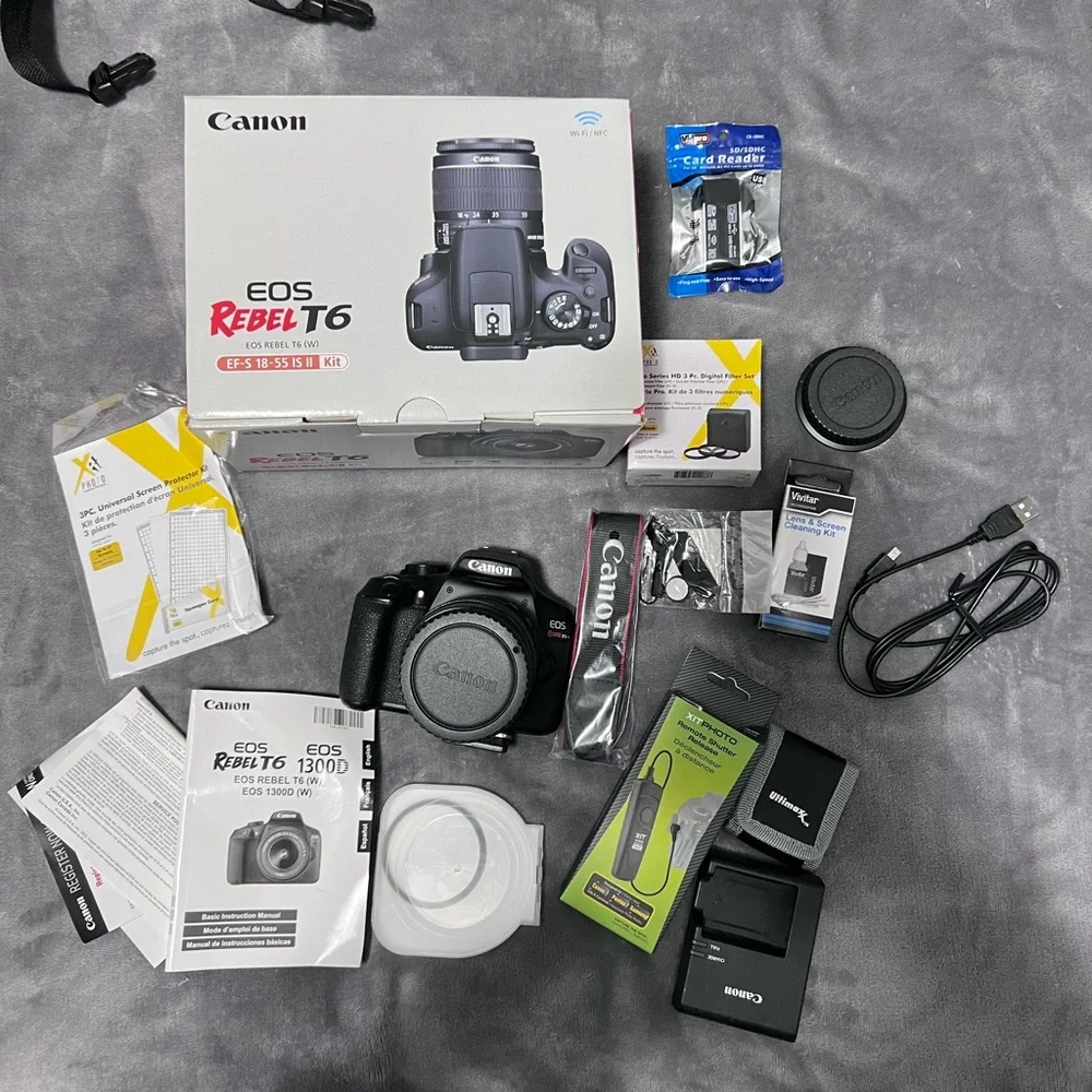 Canon Camera and a full kit with a bag and two additional lenses